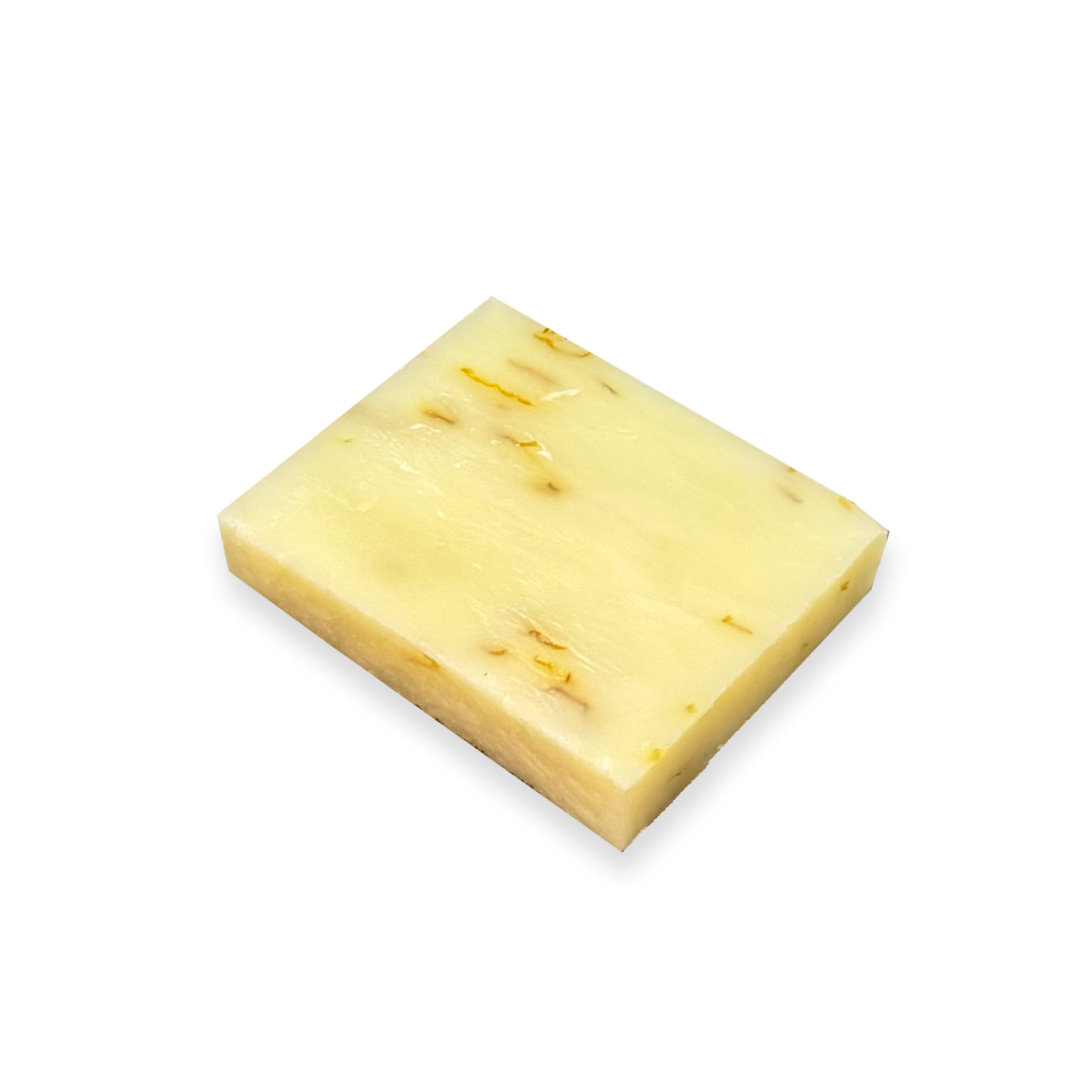 Rectangular organic Aloe & Calendula soap bar with visible  calendula petals 