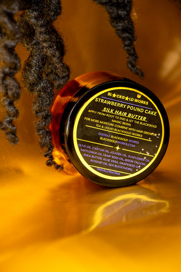 4oz jar of Black gold work's Strawberry pound cake Silk hair butter on its side, with label facing forward.
