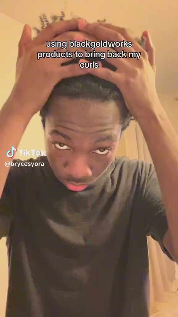 Load video: Melanted man restoring natural curl pattern Using BlackGold Works Hair kit