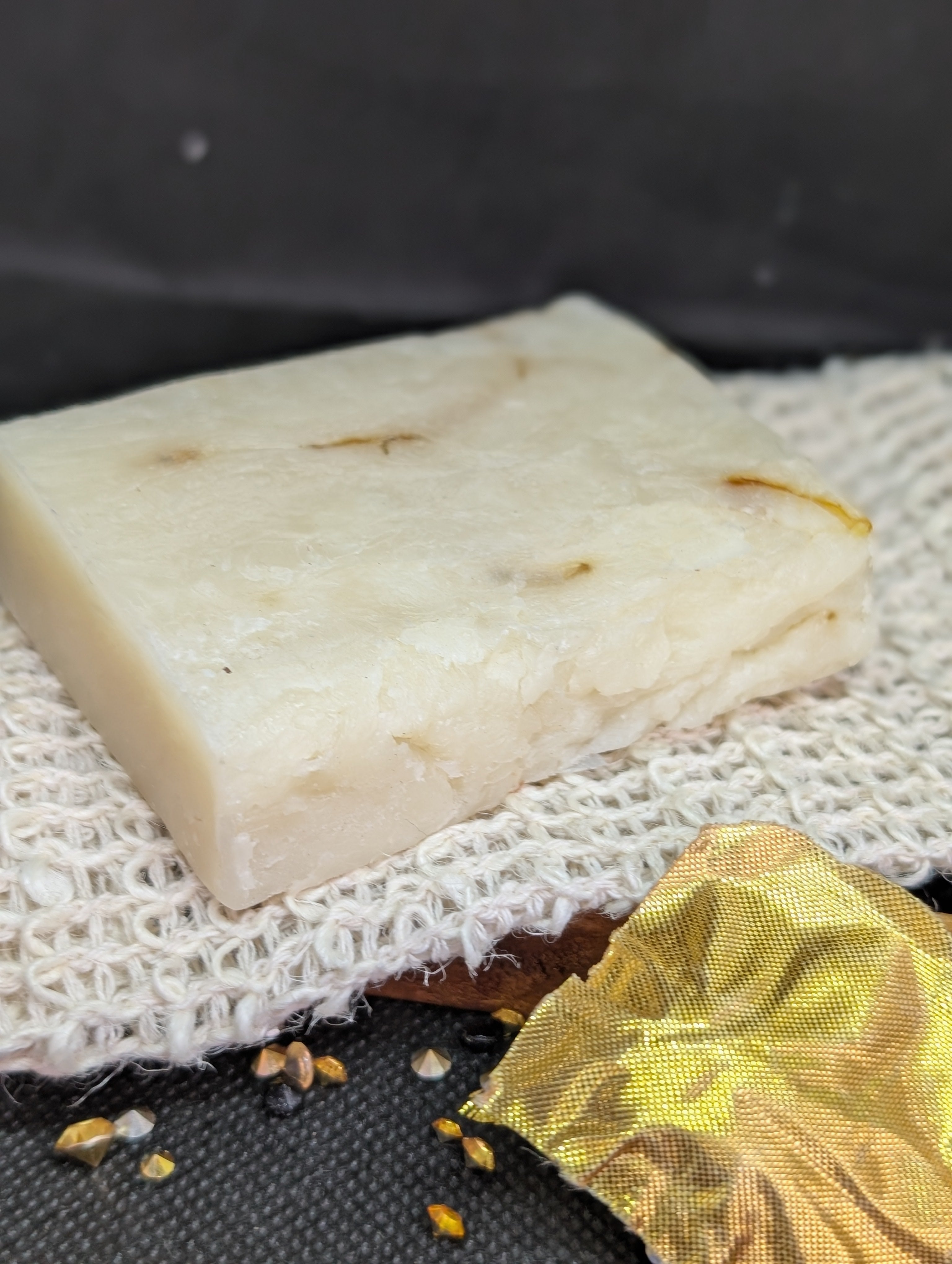 White rectangular Organic Aloe Calendula soap bar with visible calendula petals.
